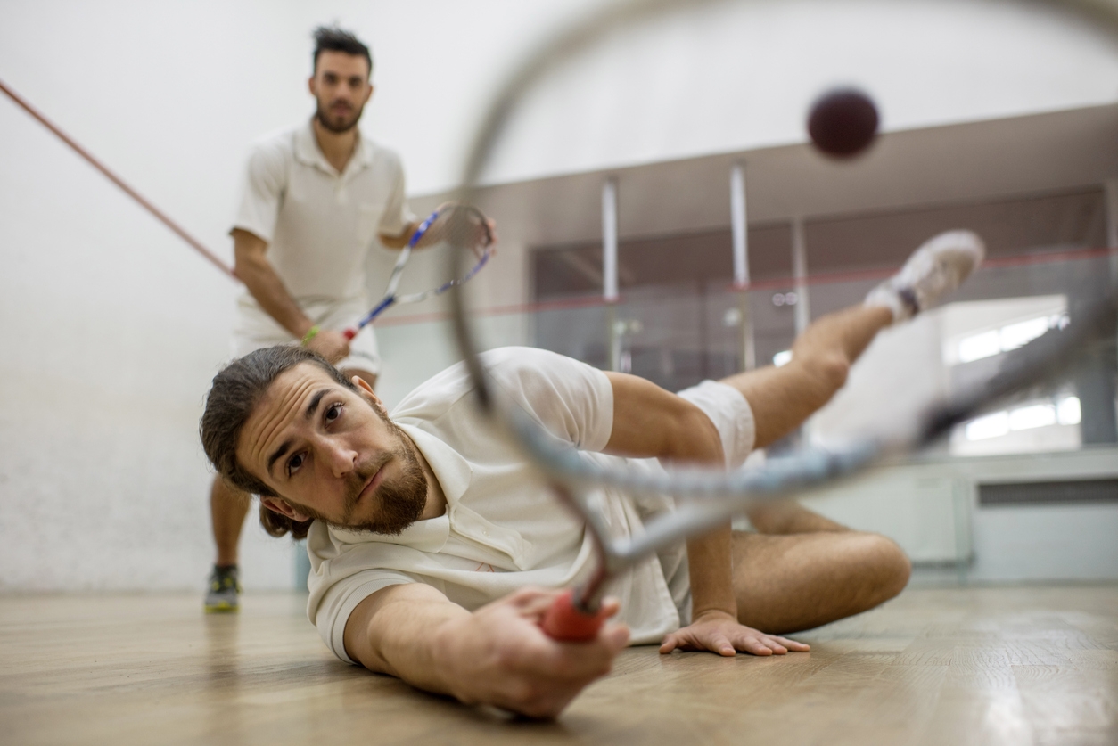 Two people playing squash