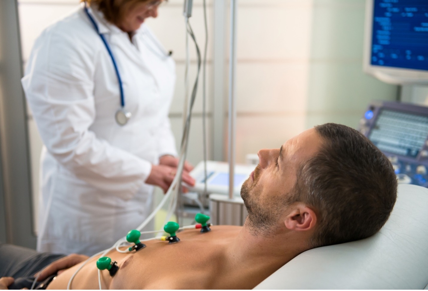 CityMD urgent care doctor giving man an EKG test