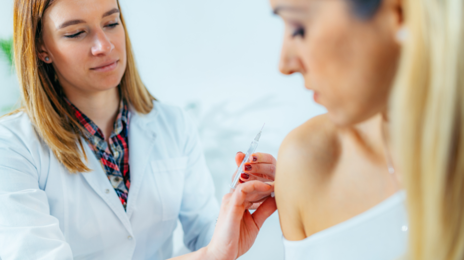 CityMD urgent care doctor administering shingles vaccine to a patient