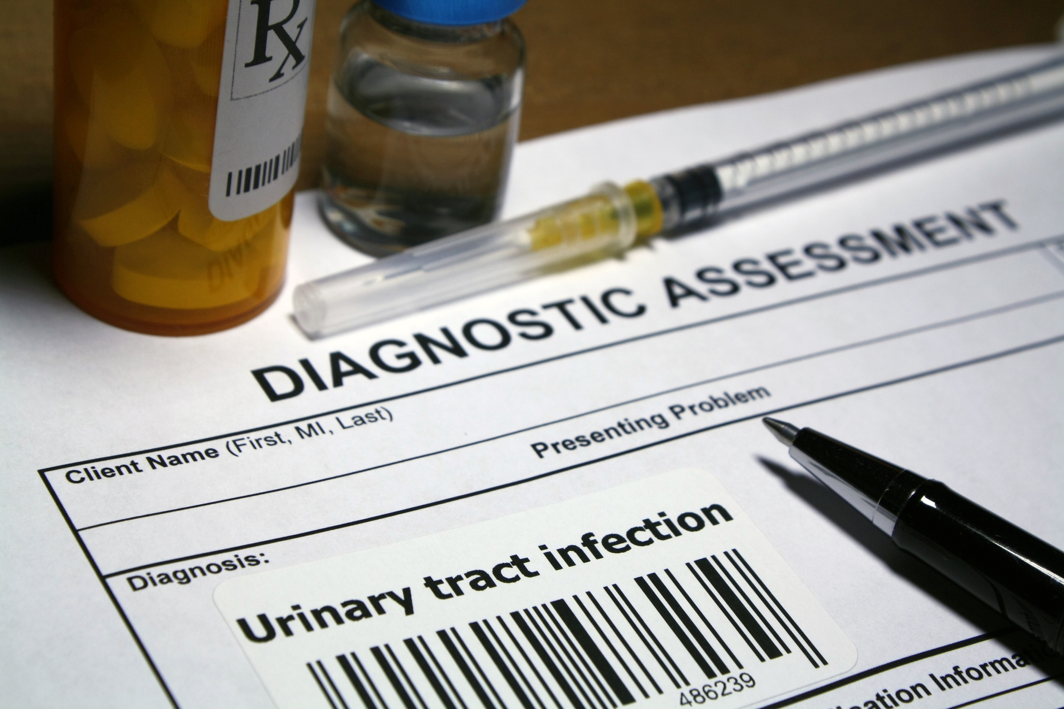 Common UTI treatments resting on paper that display urinary tract infection definition