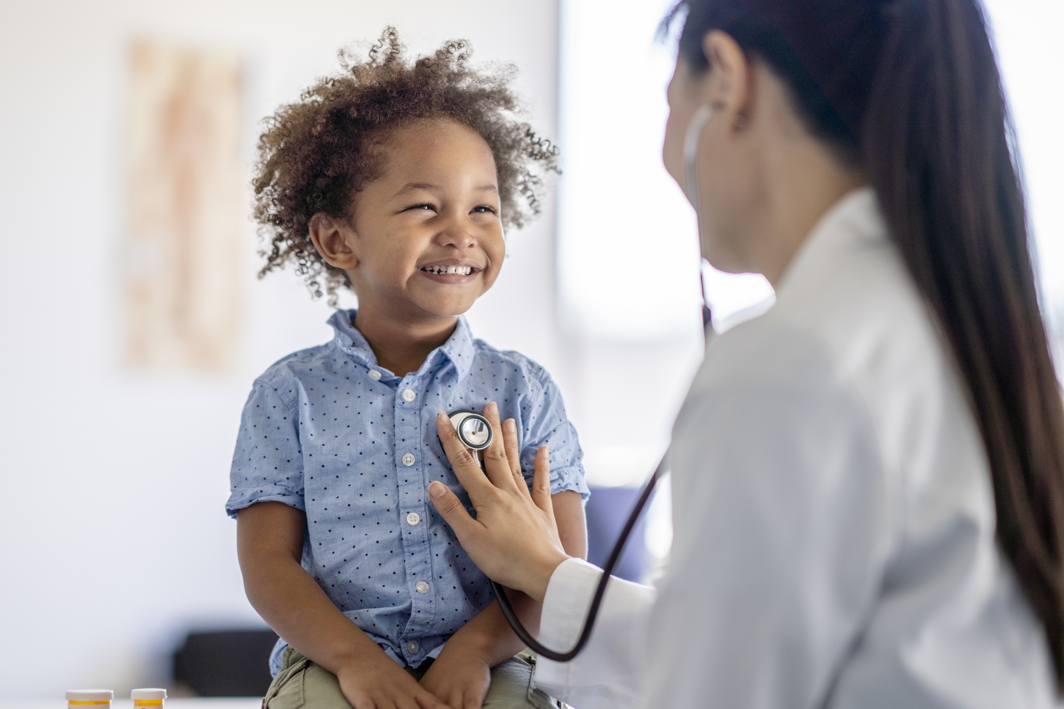 Child smiling with a New York urgent care pediatrician