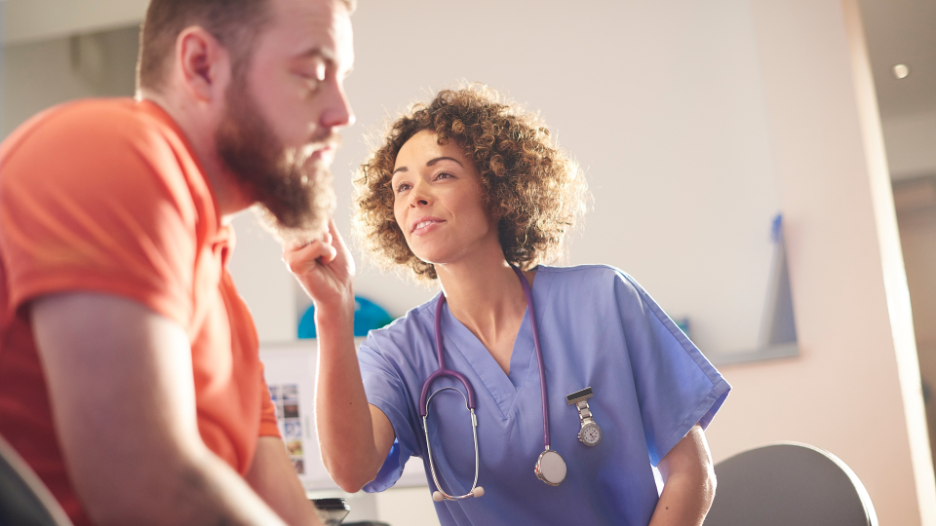 CityMD urgent care doctor performing earwax removal on patient