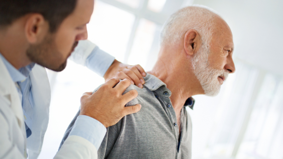 CityMD doctor helping a patient with a joint dislocation