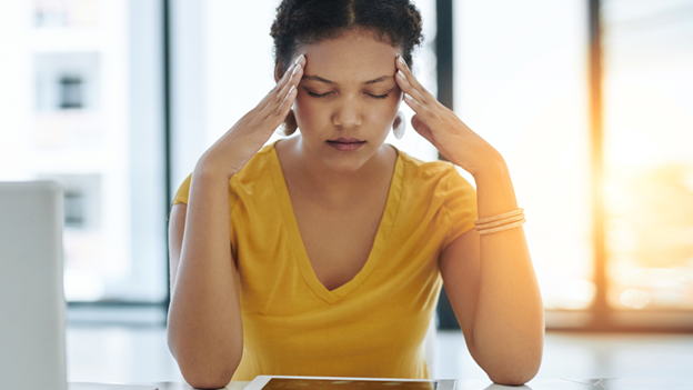 Woman suffering from migraine