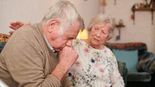 Man with long-lasting bronchitis sitting next to his wife
