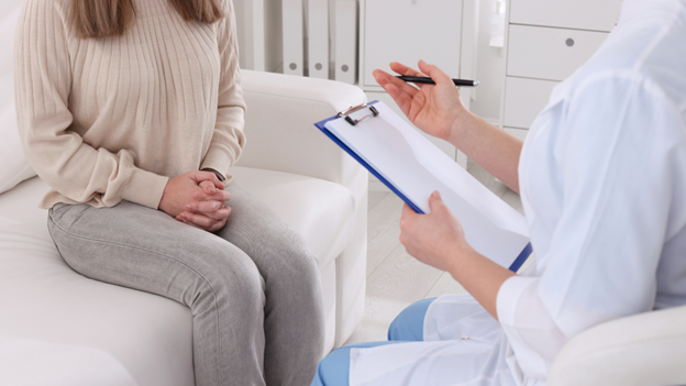 Doctor helping a woman test for gonorrhea