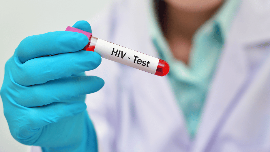 Doctor holding a vial of blood after an HIV test at a CityMD urgent care