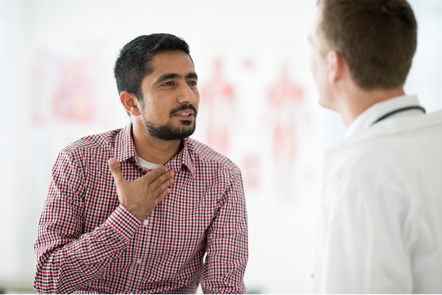 A man in pain from a chronic sore throat