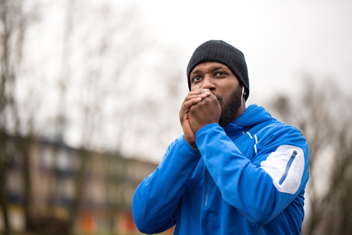 A man experiencing cold-induced asthma symptoms